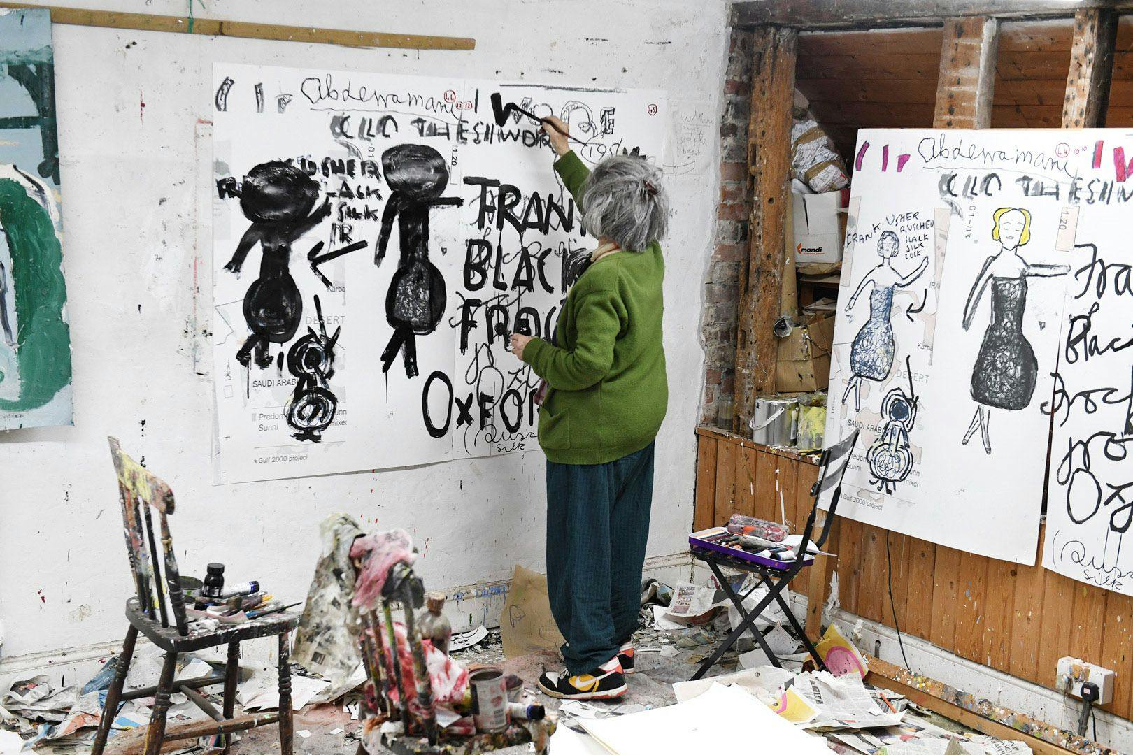 A photo by Tim Gutt of Rose Wylie working in her studio, dated 2020.